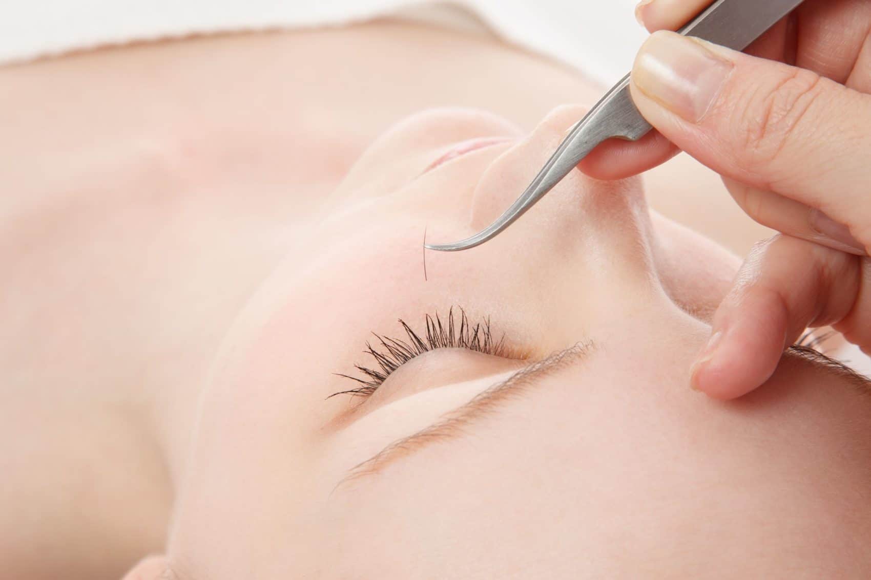 beautiful young woman eyelash extension