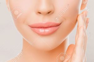 Close up of woman with perfect skin and voluptuous lips